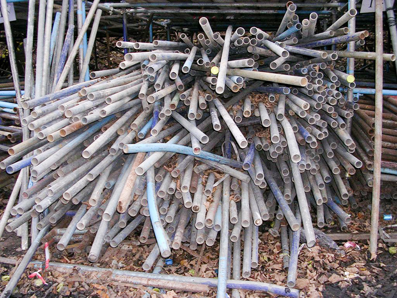 scaffold-tube-straightening-before Bent and damaged scaffold tubes before repair.